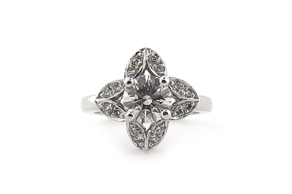 Round brilliant cut with a shaped halo