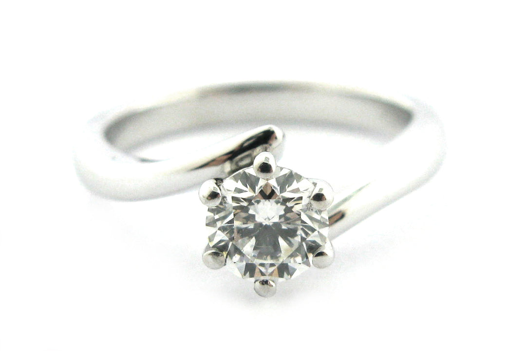 Six claw set round brilliant cut diamond with a twisted band
