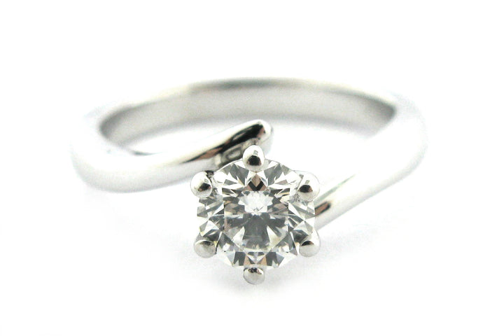 Six claw set round brilliant cut diamond with a twisted band