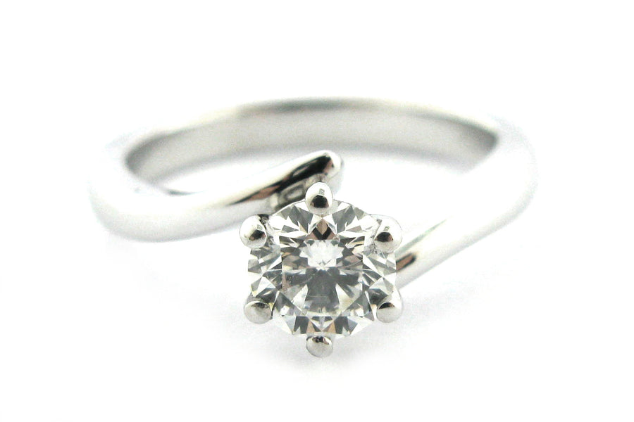 Six claw set round brilliant cut diamond with a twisted band