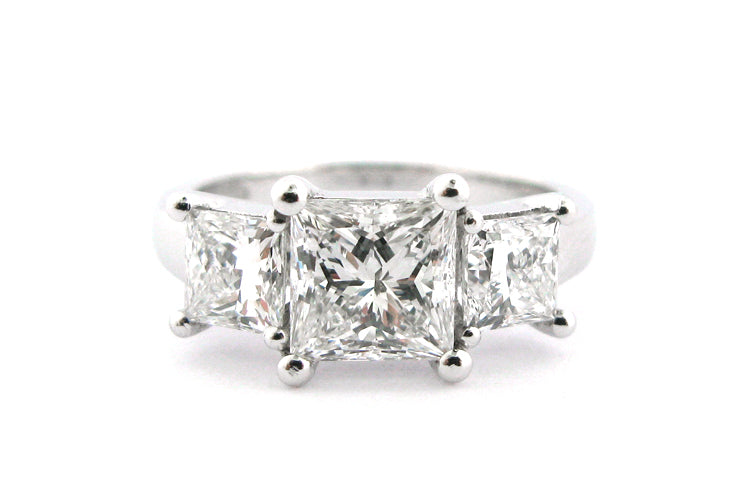Three stone princess cut diamond ring