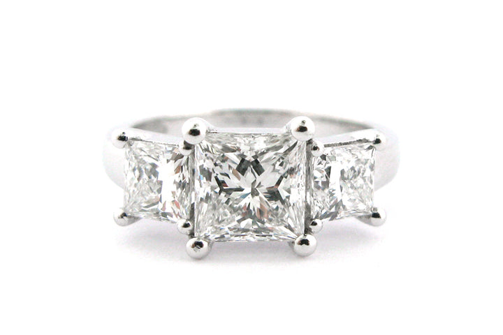 Three stone princess cut diamond ring