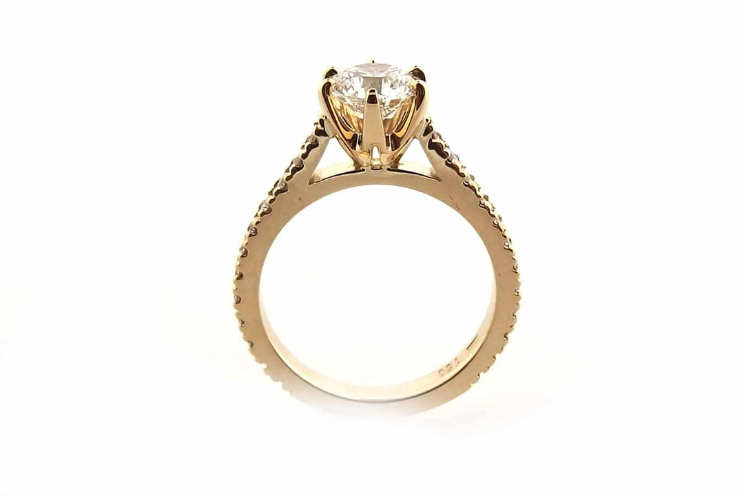 All yellow gold round brilliant cut ring