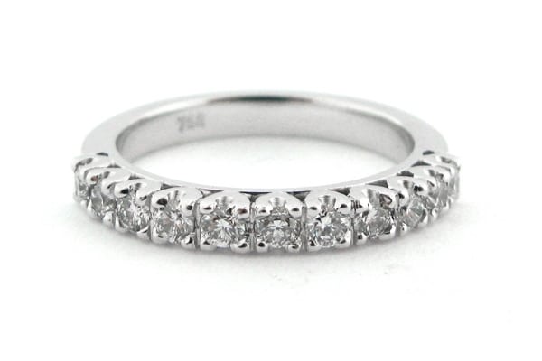 Claw set half eternity ring