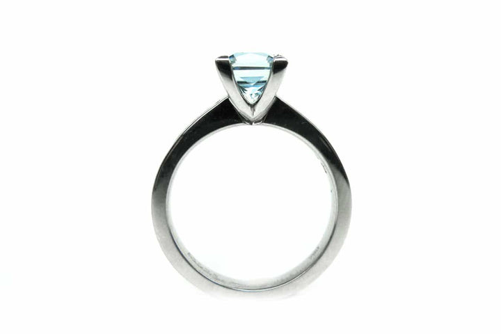 Aquamarine four claw set ring with channel set diamonds