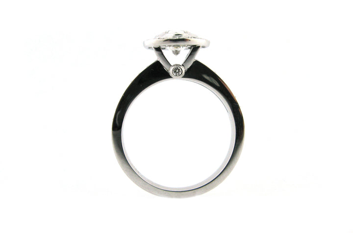 Bezel set round brilliant cut diamond halo ring with a split band