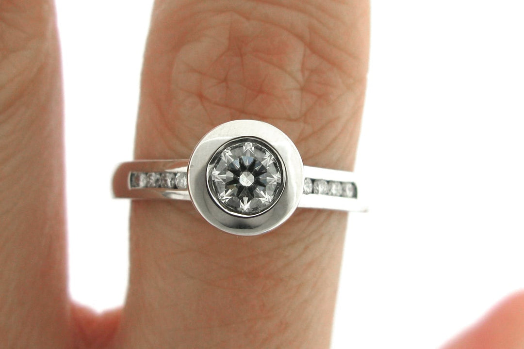 Bezel set round brilliant cut diamond ring