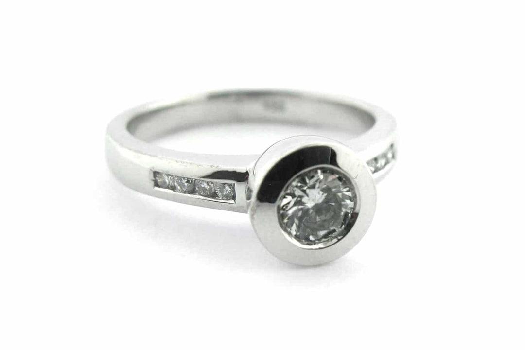 Bezel set round brilliant cut diamond ring