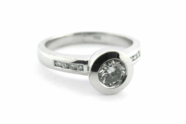 Bezel set round brilliant cut diamond ring