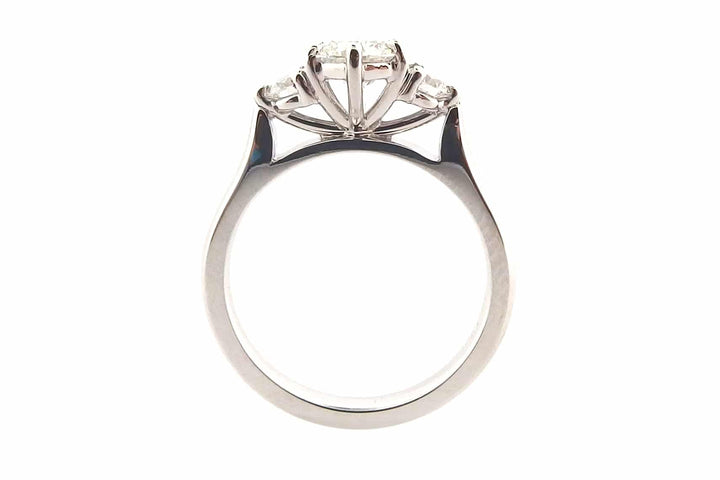 Claw set round brilliant cut three stone ring