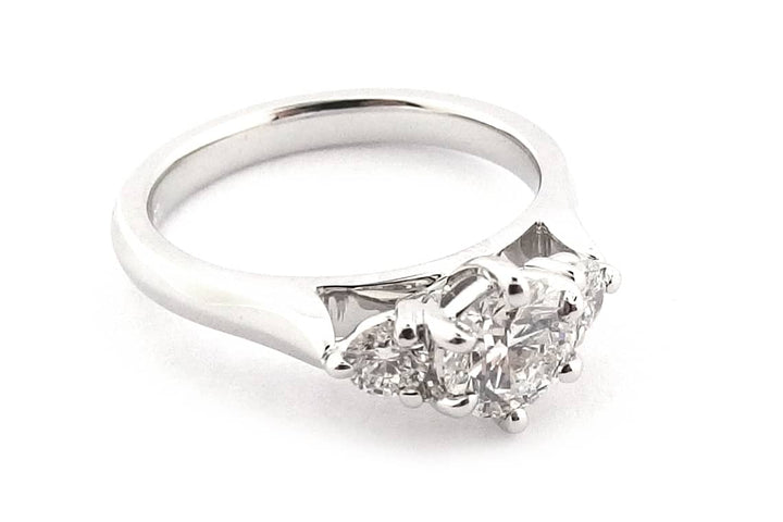 Claw set round brilliant cut three stone ring