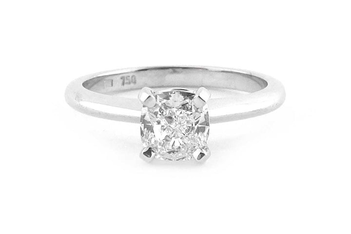 Cushion cut diamond ring with a knife edge band