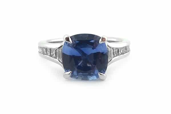 Cushion cut sapphire with graduated diamonds
