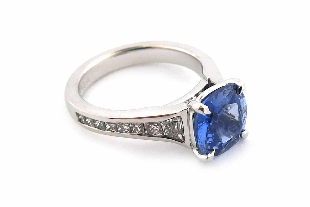 Cushion cut sapphire with graduated diamonds
