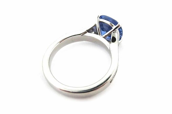 Cushion cut sapphire with graduated diamonds