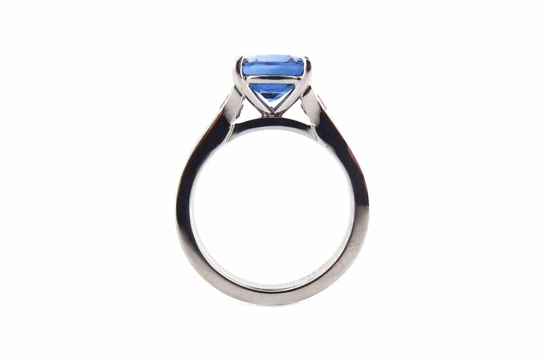 Cushion cut sapphire with graduated diamonds