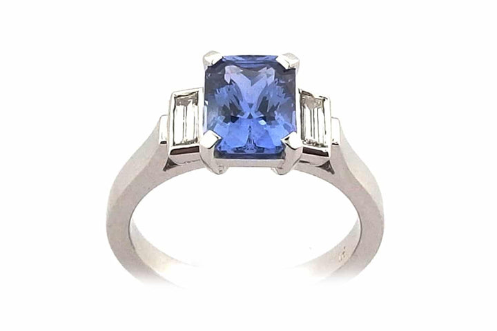 Radiant cut blue sapphire and diamond ring