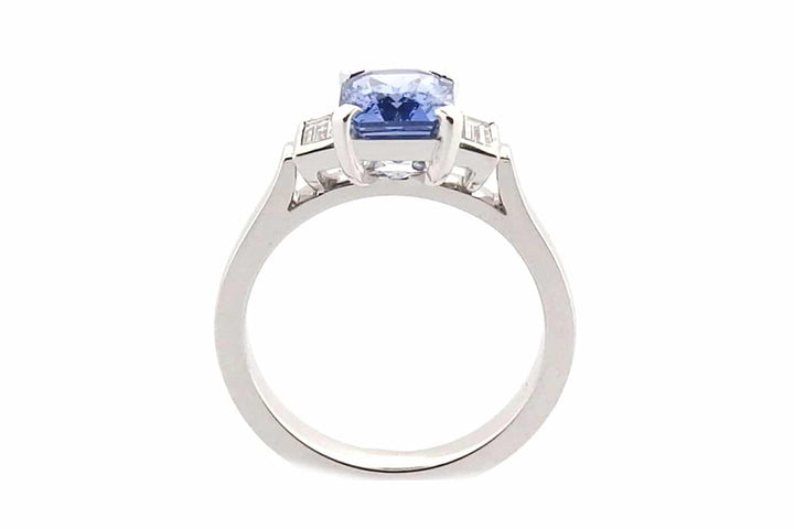 Radiant cut blue sapphire and diamond ring