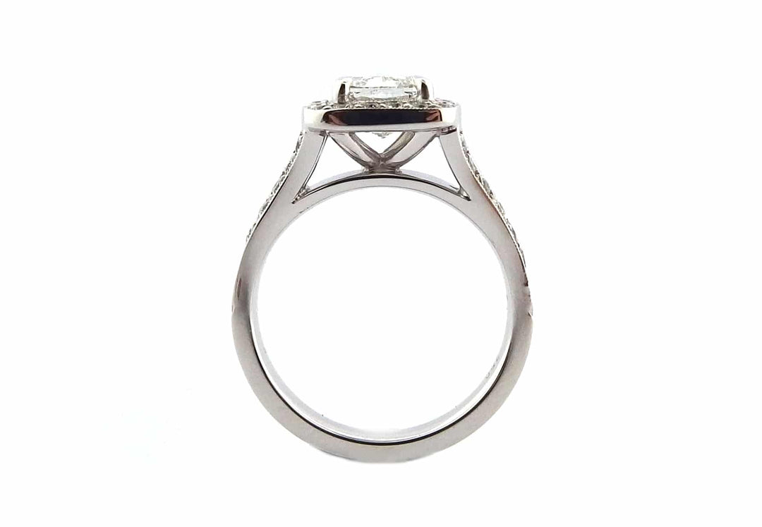 Halo ring with a spit band and a milgrain edge