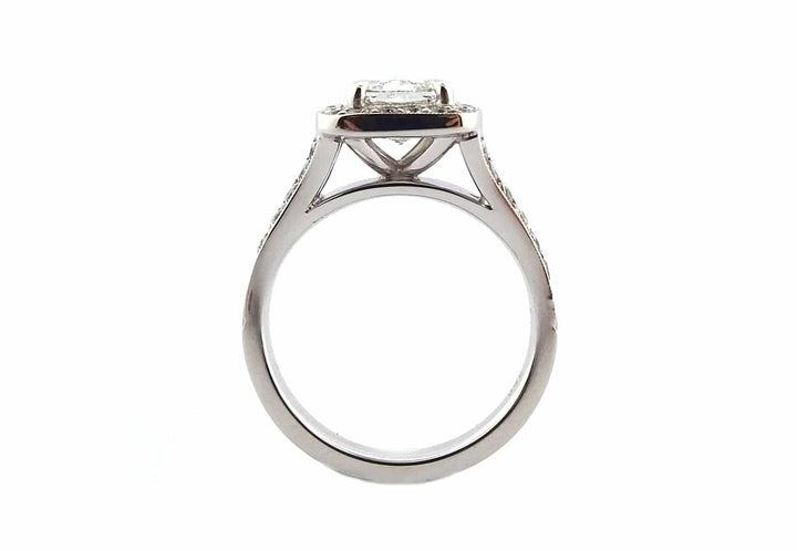 Halo ring with a spit band and a milgrain edge