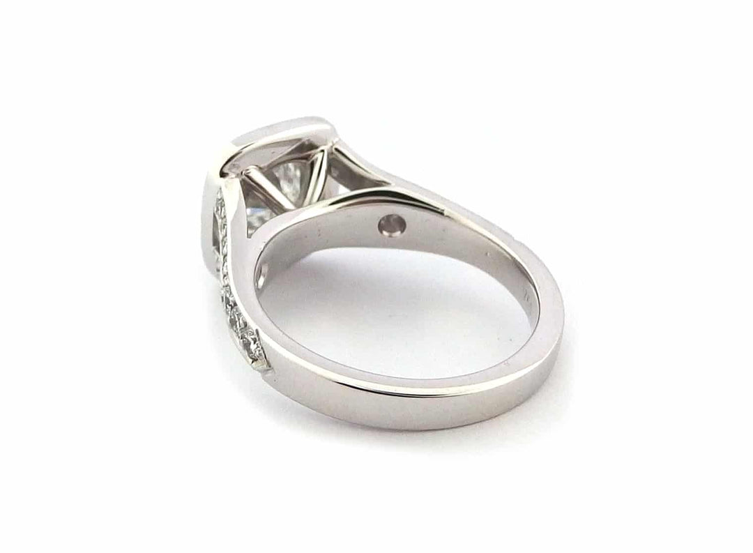 Halo ring with a spit band and a milgrain edge