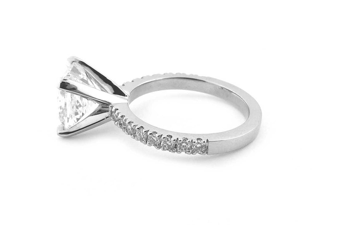 Cushion cut diamond ring with bead set diamonds