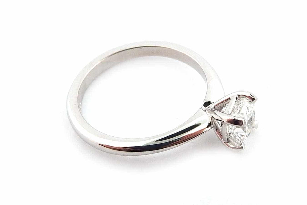Cushion cut diamond ring with a knife edge band