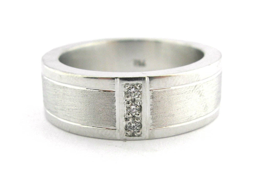Brushed and polished men's wedding band with a vertical row of diamonds