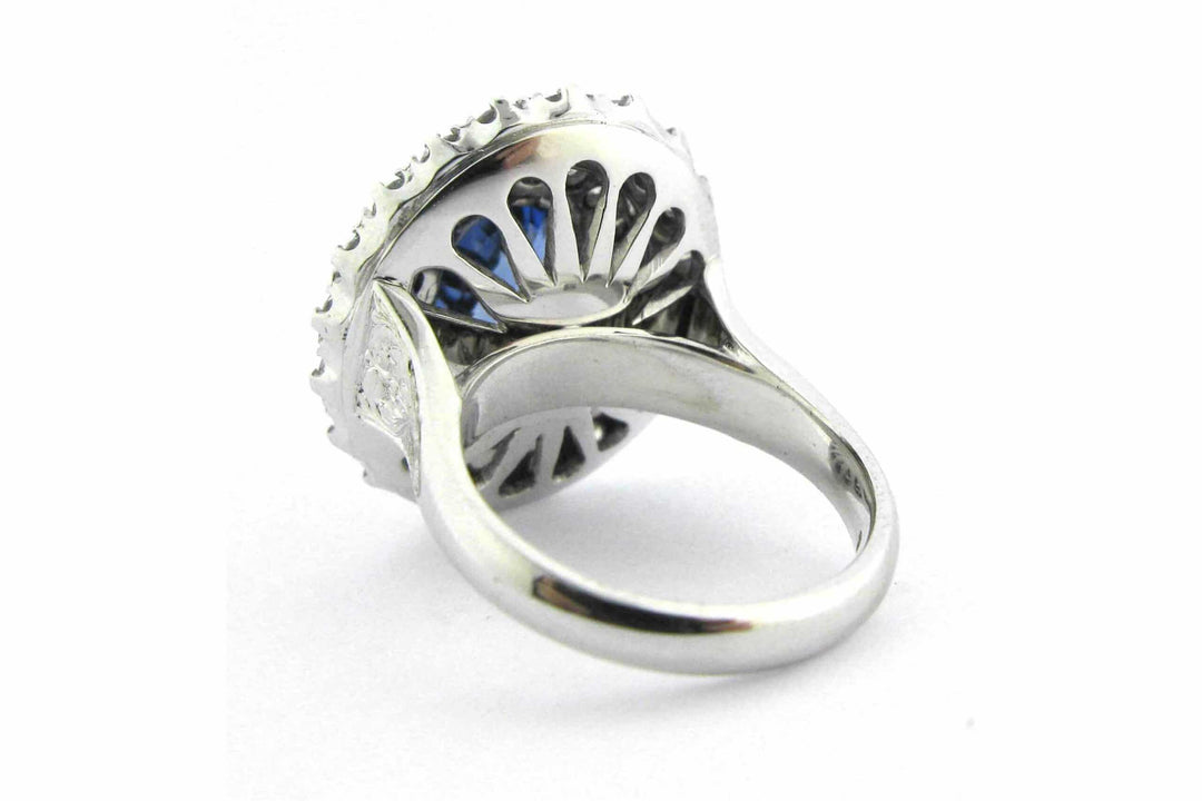 Blue oval sapphire ring with a double halo