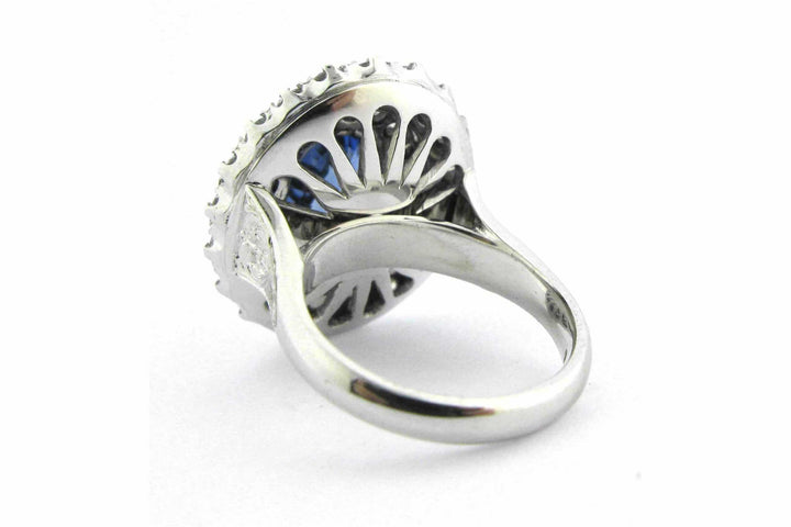 Blue oval sapphire ring with a double halo