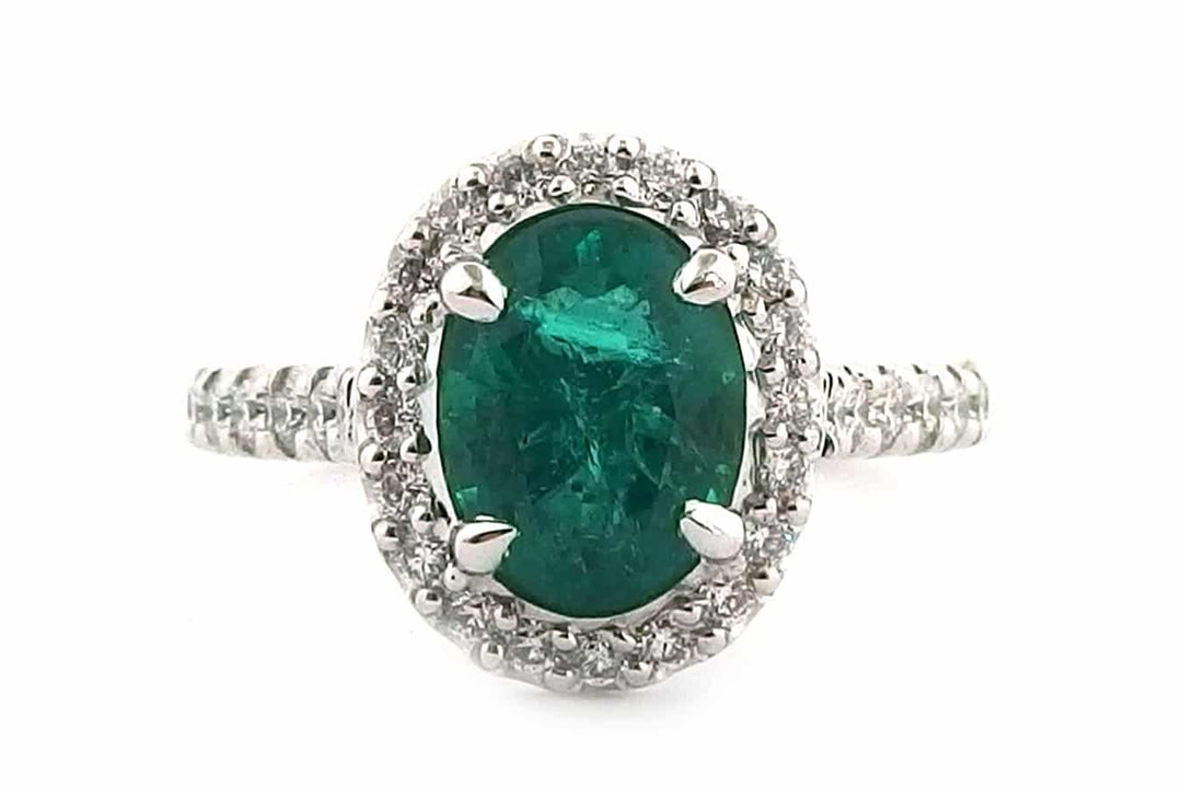 Handmade 18ct White Gold Halo Ring Set With an Oval Cut Emerald