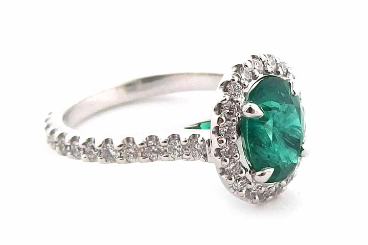 Handmade 18ct White Gold Halo Ring Set With an Oval Cut Emerald