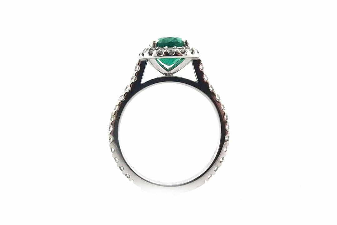Handmade 18ct White Gold Halo Ring Set With an Oval Cut Emerald
