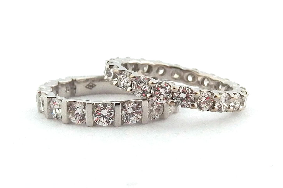 Bar and claw set diamond rings