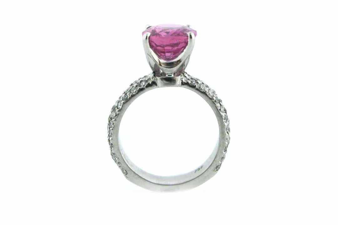 Pink cushion cut sapphire with a diamond set band