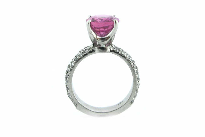 Pink cushion cut sapphire with a diamond set band