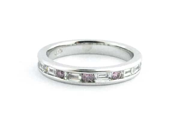 Pink diamond and baguette wedding band