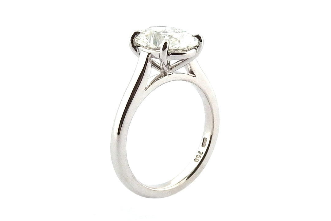Platinum oval diamond ring with a fine four claw setting