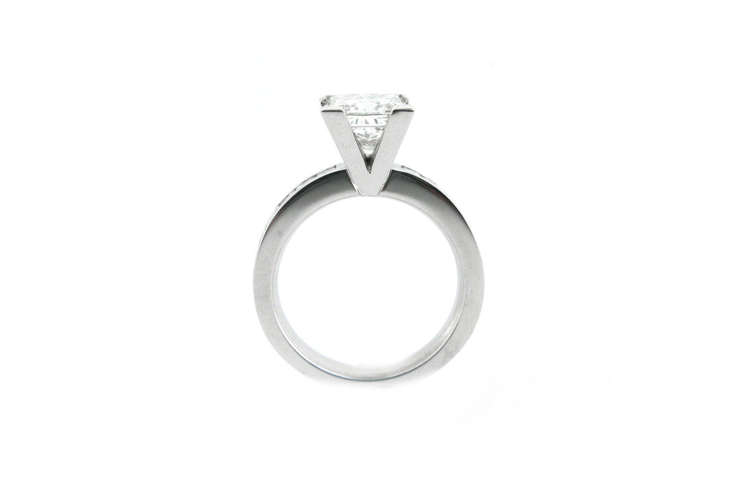 Princess cut diamond ring with channel princess cut diamonds in the band