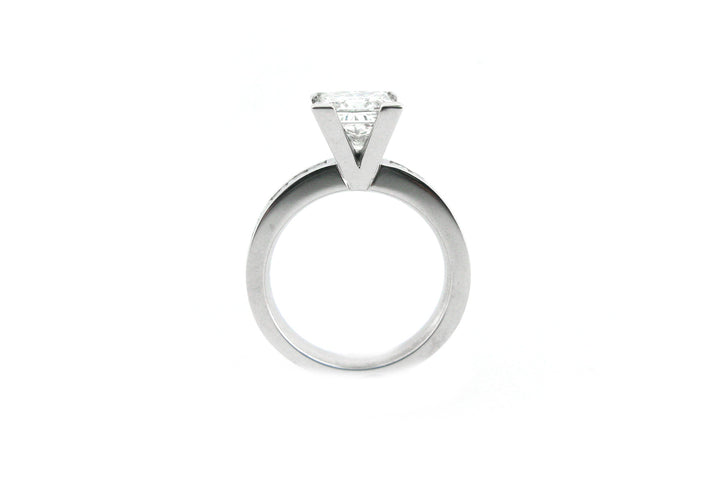 Princess cut diamond ring with channel princess cut diamonds in the band