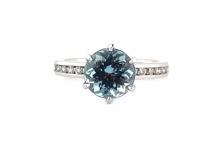 Round aquamarine and diamond ring