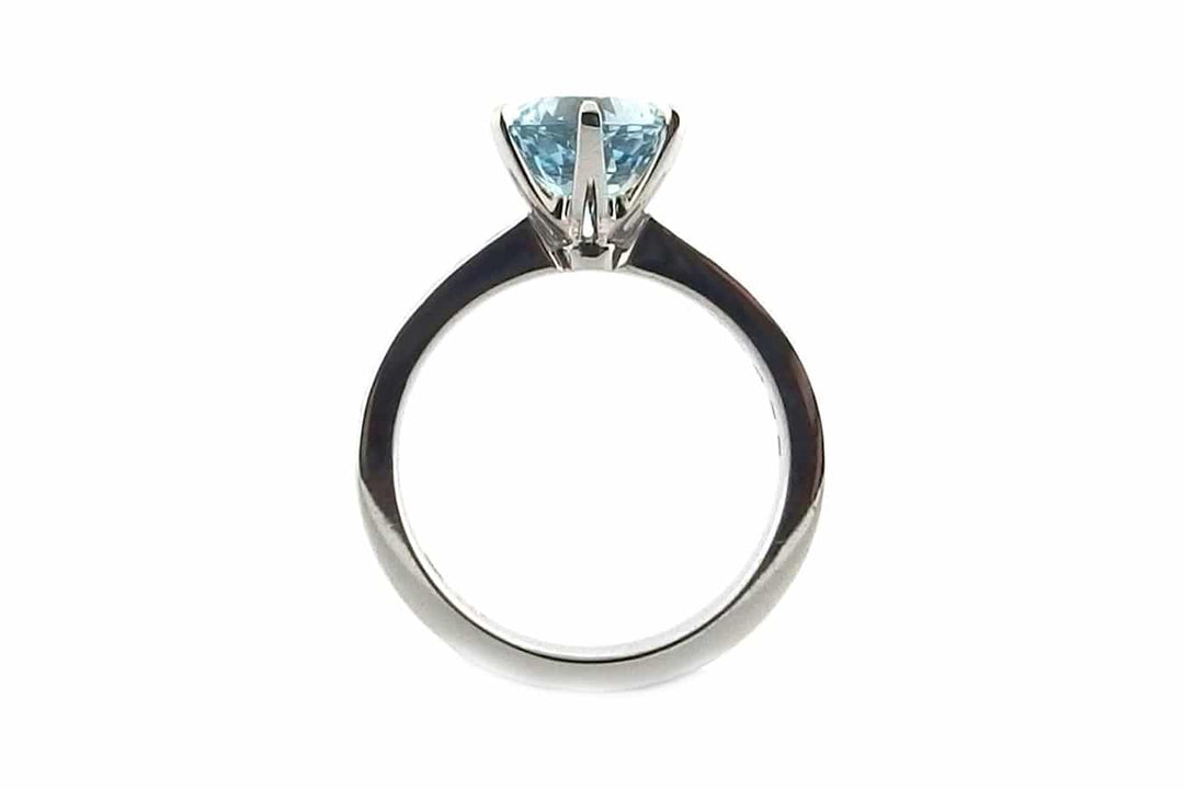 Round aquamarine and diamond ring