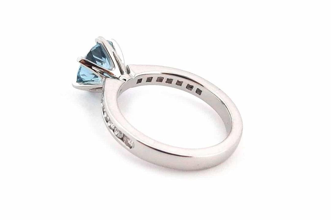 Round aquamarine and diamond ring
