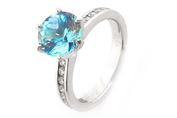 Round aquamarine and diamond ring