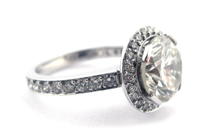 Round brilliant cut diamond ring set with long claws