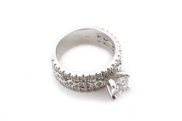 Round brilliant cut diamond ring with three bands