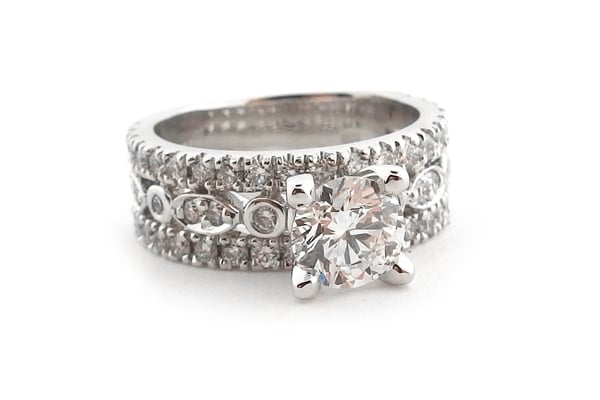 Round brilliant cut diamond ring with three bands