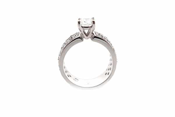 Round brilliant cut ring with three rows of diamonds