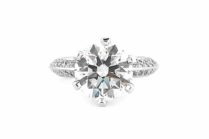 Round brilliant cut with diamonds on the band and setting