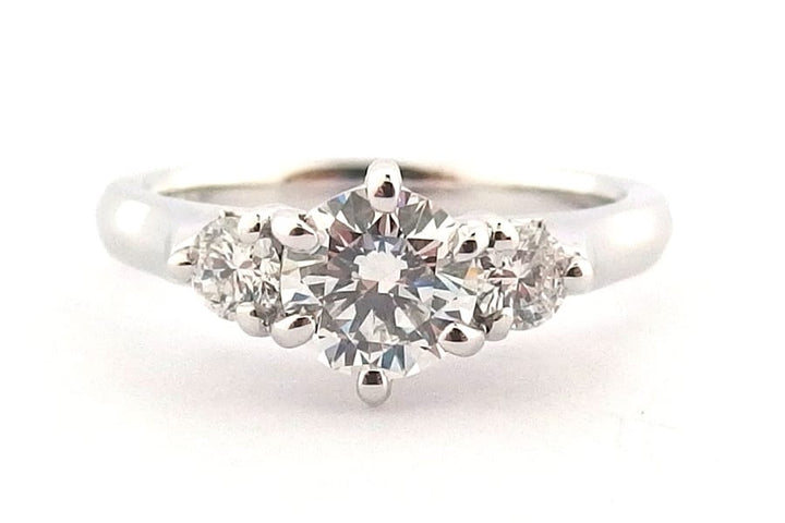 Claw set round brilliant cut three stone ring